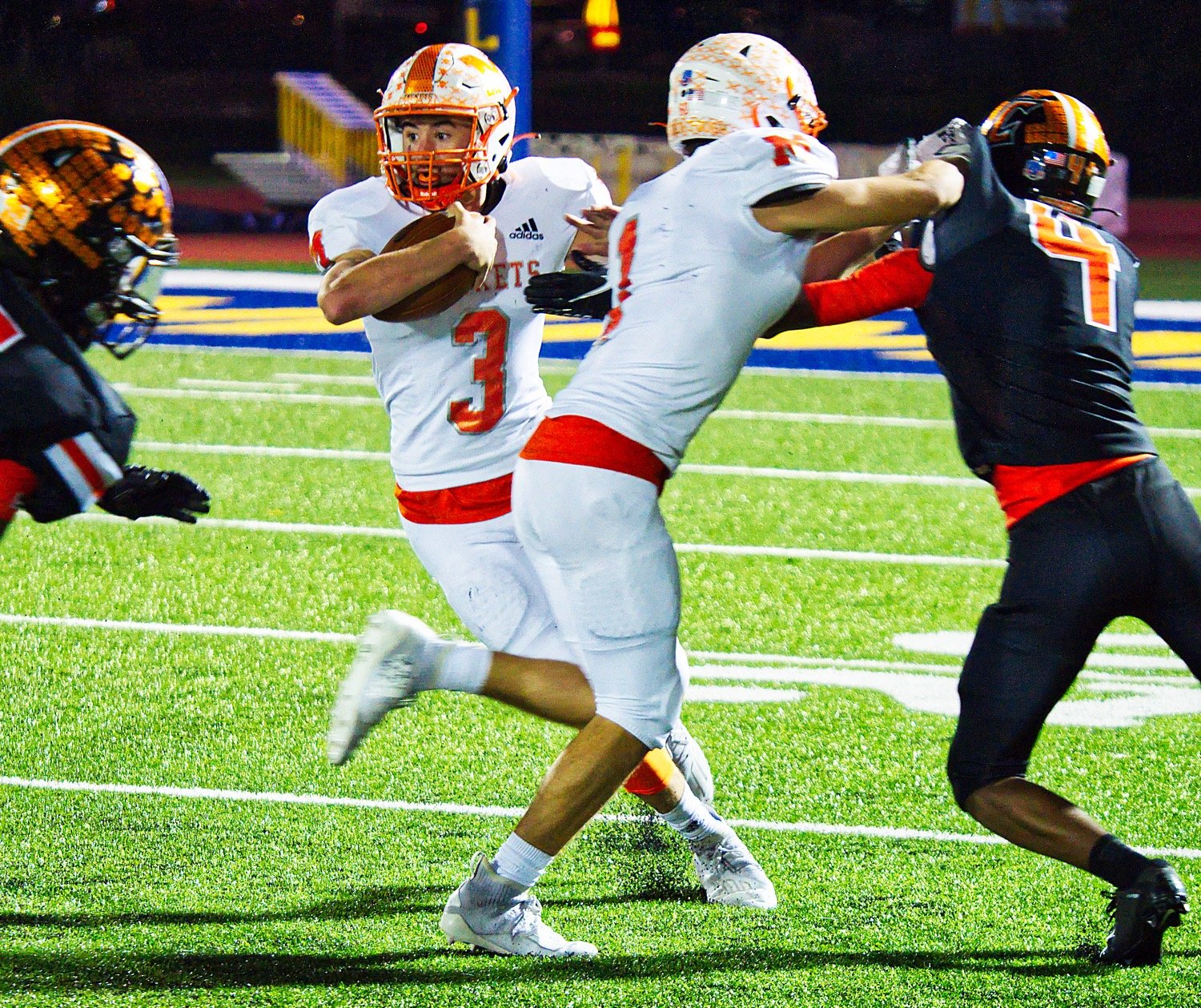 Mineola’s T.J. Moreland, 3, looks for an opening with blocking help from Thomas Hooten Friday against Commerce.
[see more action and buy prints]